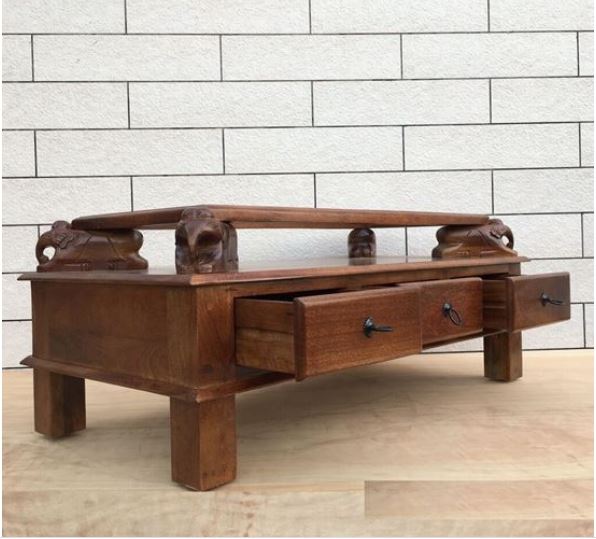 Asgil coffee table with assorted hand carving elephants with 3 drawers.