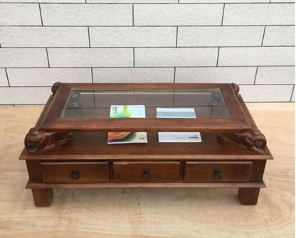 Asgil coffee table with assorted hand carving elephants with 3 drawers. top view