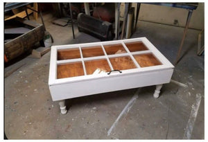 Solid wood coffee table made with reclaimed window pane in natural wood finish