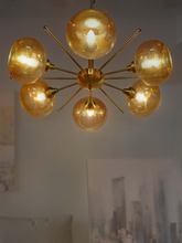 Load image into Gallery viewer, Luxurious Satellite-Like 6 Light Brass Chandelier with Golden Glass Shades