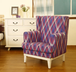 Armchair customized with seasoned kiln-dried solid wood and cushioned with branded medium density foam with a high back wing to give enough comfort & softness that you'll sink into. Upholstered with handwoven ikat fabric Wing Armchair bring style to your living room seating. 