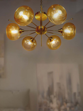 Load image into Gallery viewer, Luxurious Satellite-Like 6 Light Brass Chandelier with Golden Glass Shades home placement