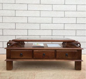 Asgil coffee table with assorted hand carving elephants with 3 drawers.