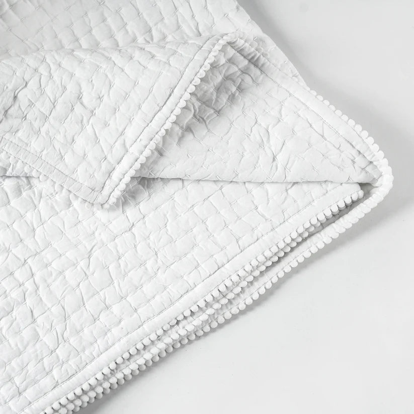 SHWET - White cotton kantha quilted bedspread with small pompom lace at seams and classic stripe pattern quilting