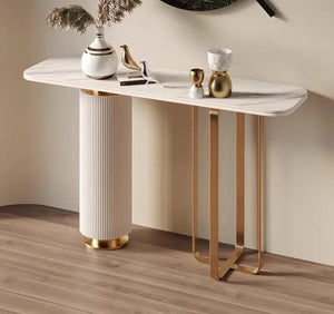 This console table is crafted from sturdy metal with a sleek gold finish.