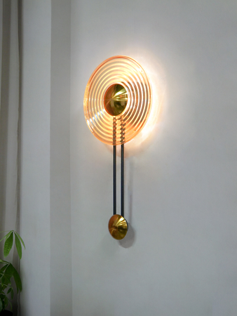 Modern Golden Pendulum-Style Steel And Round Amber Glass Decorative LED Wall Lamp