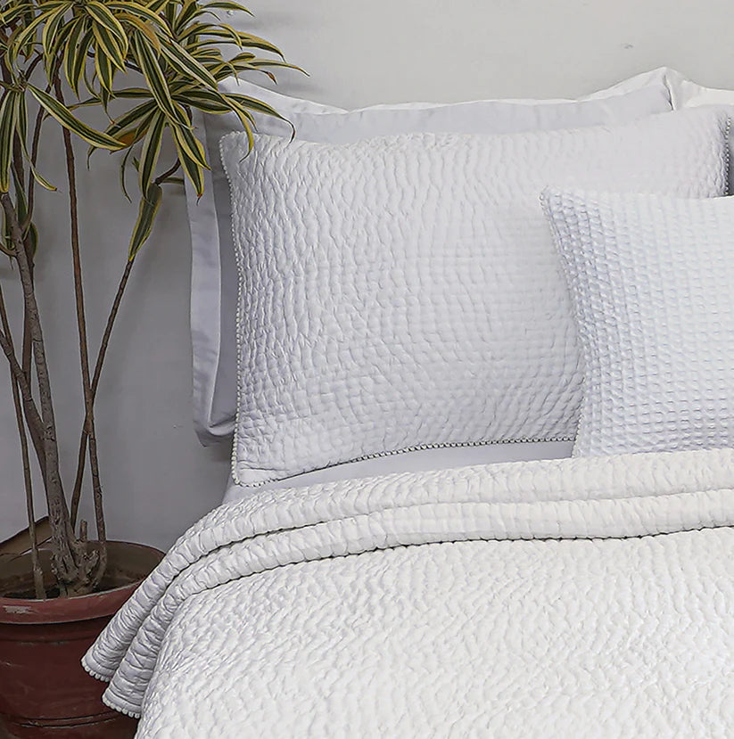 SHWET - White cotton kantha quilted bedspread with small pompom lace at seams and classic stripe pattern quilting