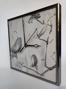 Silver tile and metal clock